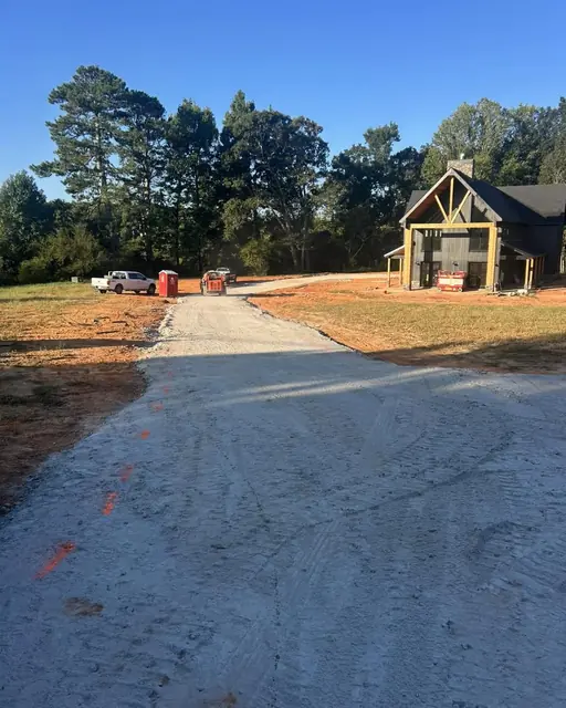 Graded stone base for a long driveway at a new construction home