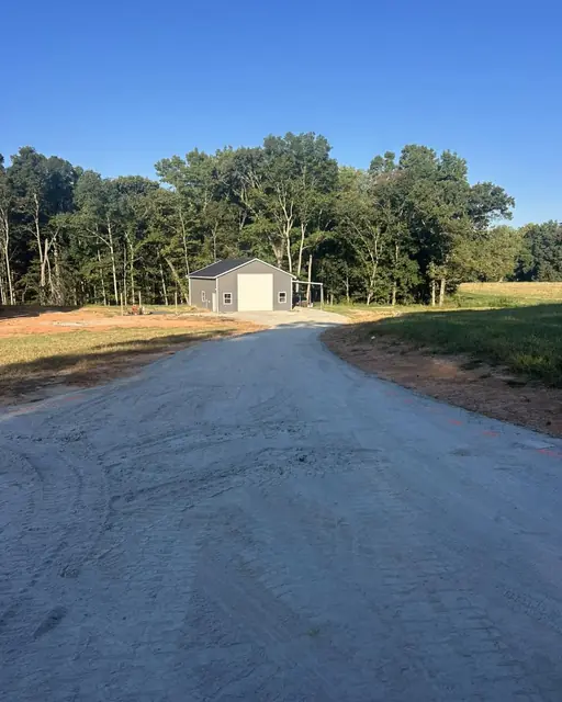 Compacted millings and stone base on a long country driveway