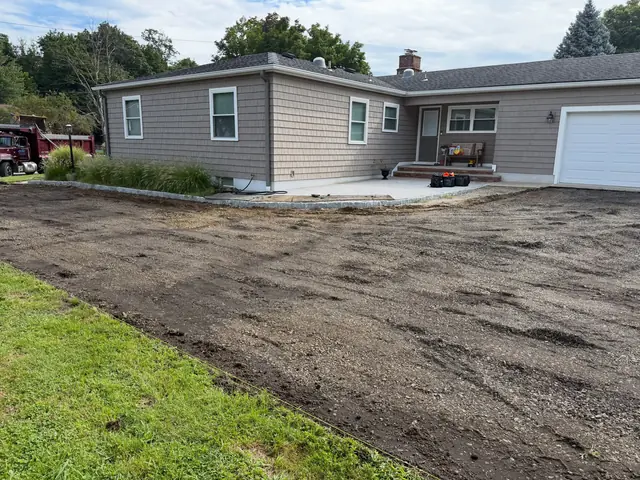 Old driveway removed and soil exposed during site preparation